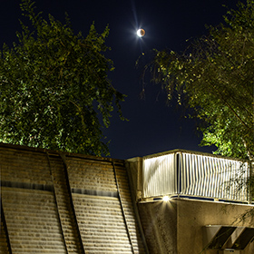 Lunar Eclipse of the moon over Tempe Arizona Gammage Auditorium.